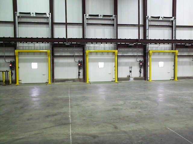 Photo of a series of vertical doors in a cold storage warehouse.
